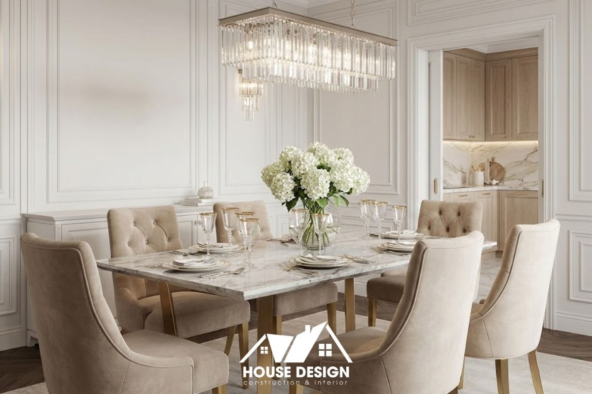 Bộ bàn ăn 6 ghế bọc nỉ cao cấp với chân mạ vàng trong không gian bếp ăn chung cư phong cách tân cổ điển.